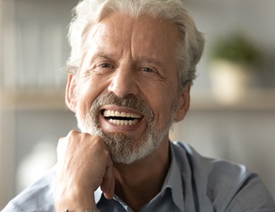 Closeup of man smiling with dentures in Superior