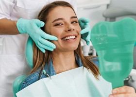 a patient smiling after receiving veneers in Superior