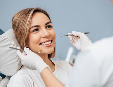 Woman visiting dentist for dental checkup and cleaning in Superior, WI