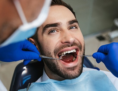 Man seeing cosmetic dentist in Superior