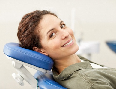 A young female lying on her back in the dentist’s chair waiting for treatment