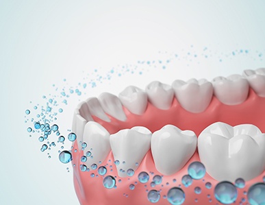 a computer illustration showing fluoride surrounding teeth