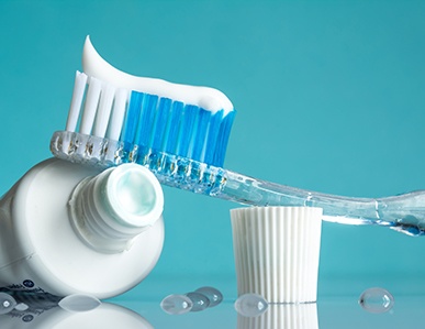a tube of toothpaste and a toothbrush