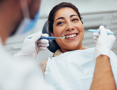 a woman having her teeth cleaned