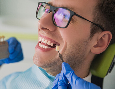 Man smiling as he gets dental implants in Superior