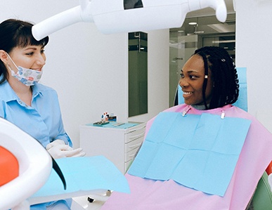 Woman speaking with dentist