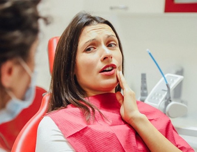 Woman at dentist for root canal therapy in Superior