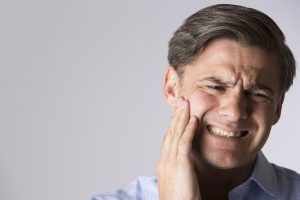 man with tooth pain