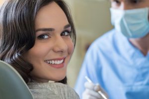 A woman seeing a dentist during COVID-19.