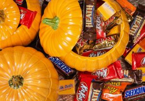 Glass pumpkins filled with Halloween candy