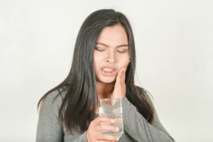 Woman with tooth sensitivity