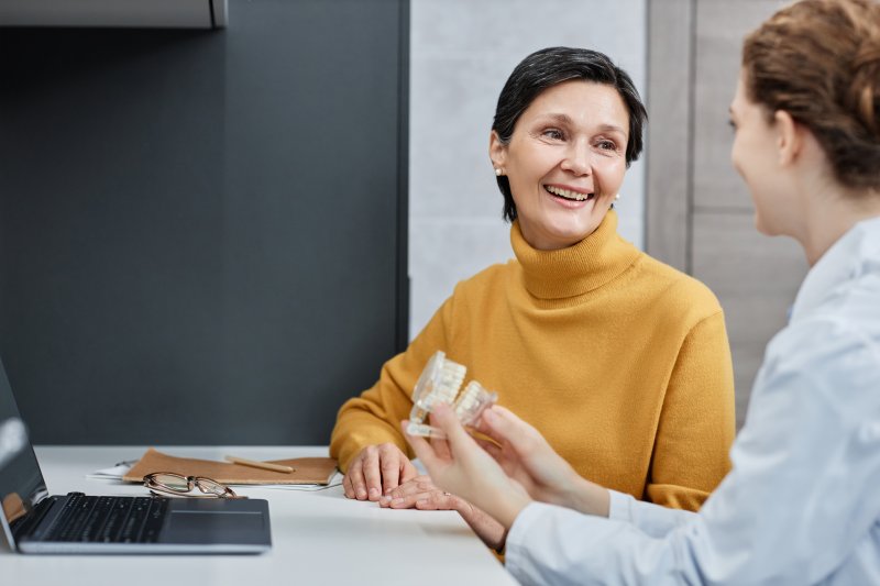 Patient talking to their dentist about dental implants